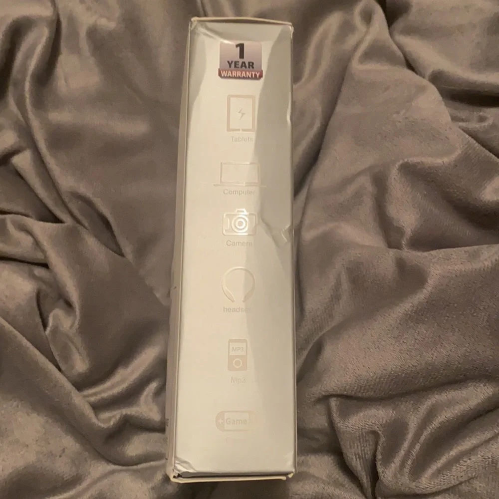 MacBook Air charger. 45w. Additional USB & Type-C charge for other gadgets.